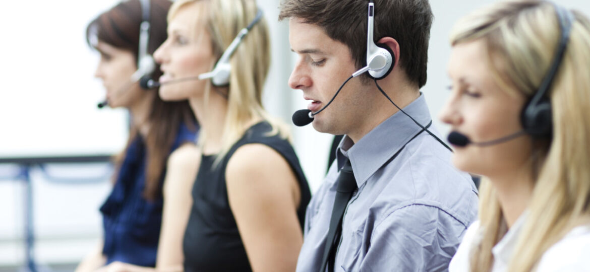 Attractive young man working in a call center